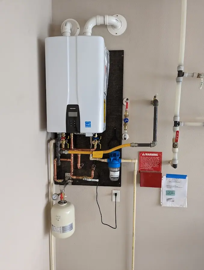 Professional plumber installing copper piping in a Seven Hills home